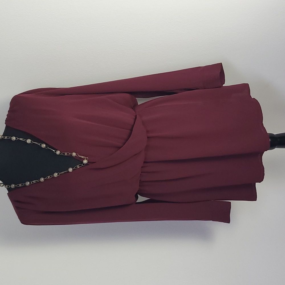 NWT Chic Cache burgundy blouse with peek a boo cutout in back.